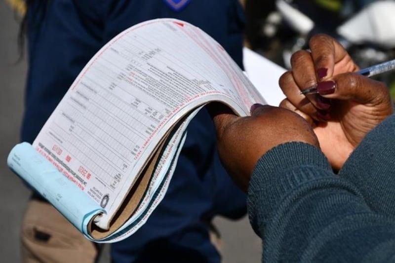 Infringement notice being reviewed and signed